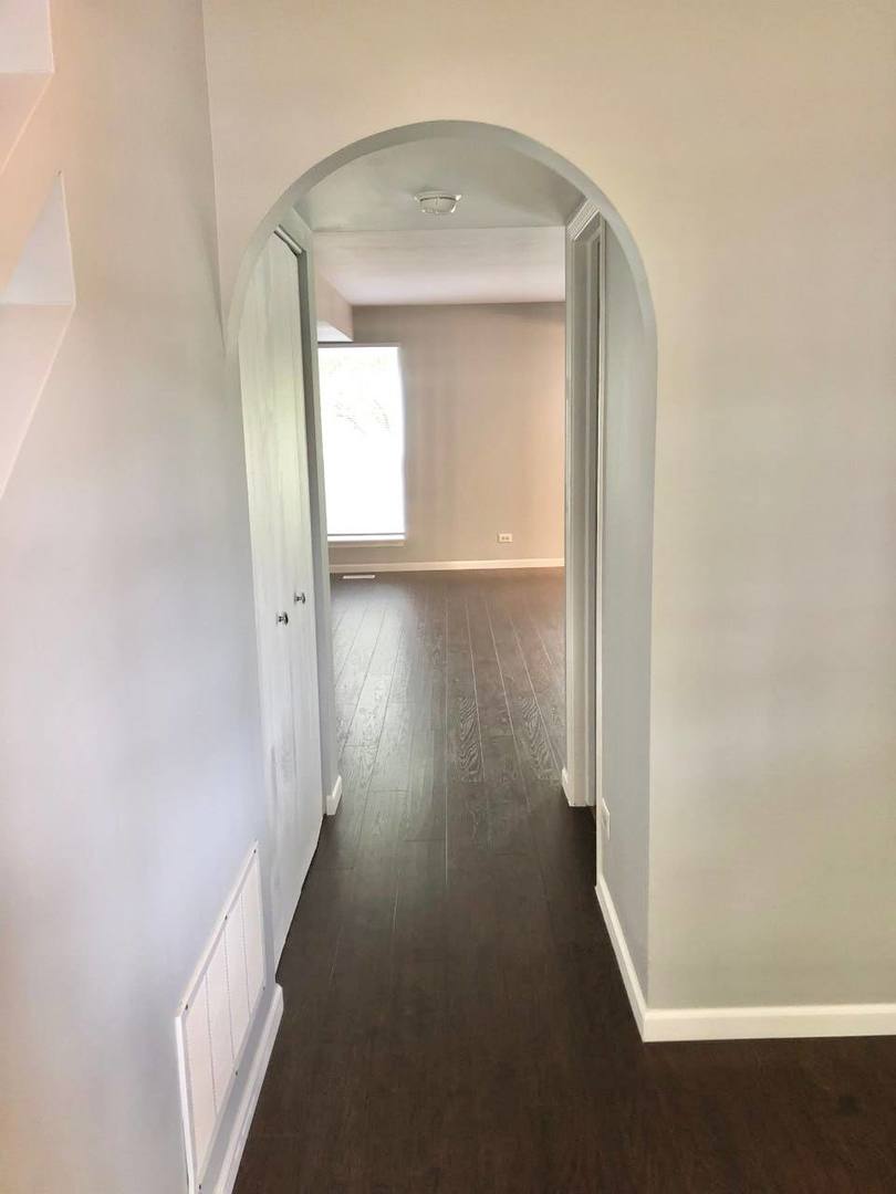 278 Half Moon Circle Aurora, IL 60504 - Photo 2 of 19 view of a room with wooden floor