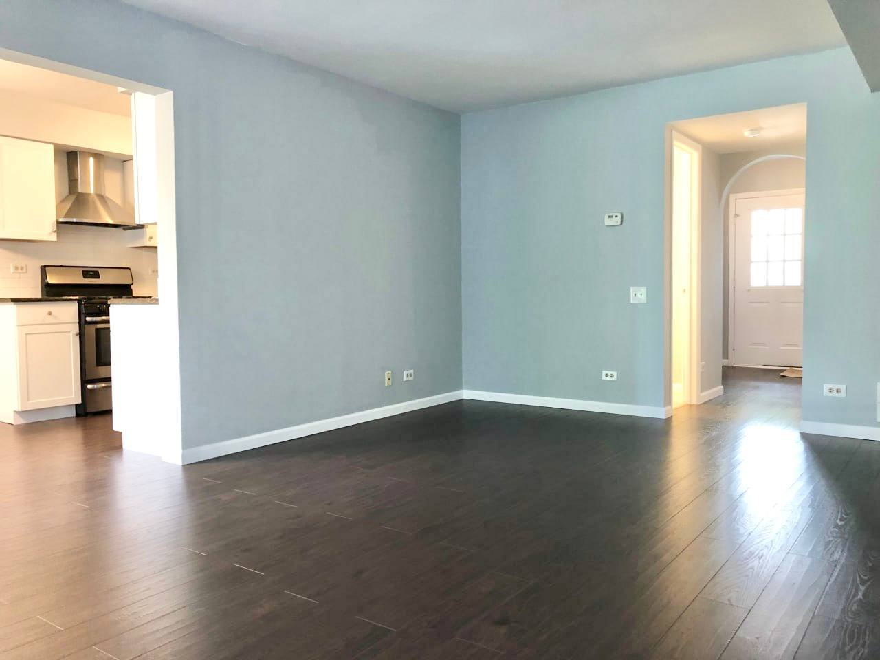 278 Half Moon Circle Aurora, IL 60504 - Photo 5 of 19 an empty room with wooden floor and a window