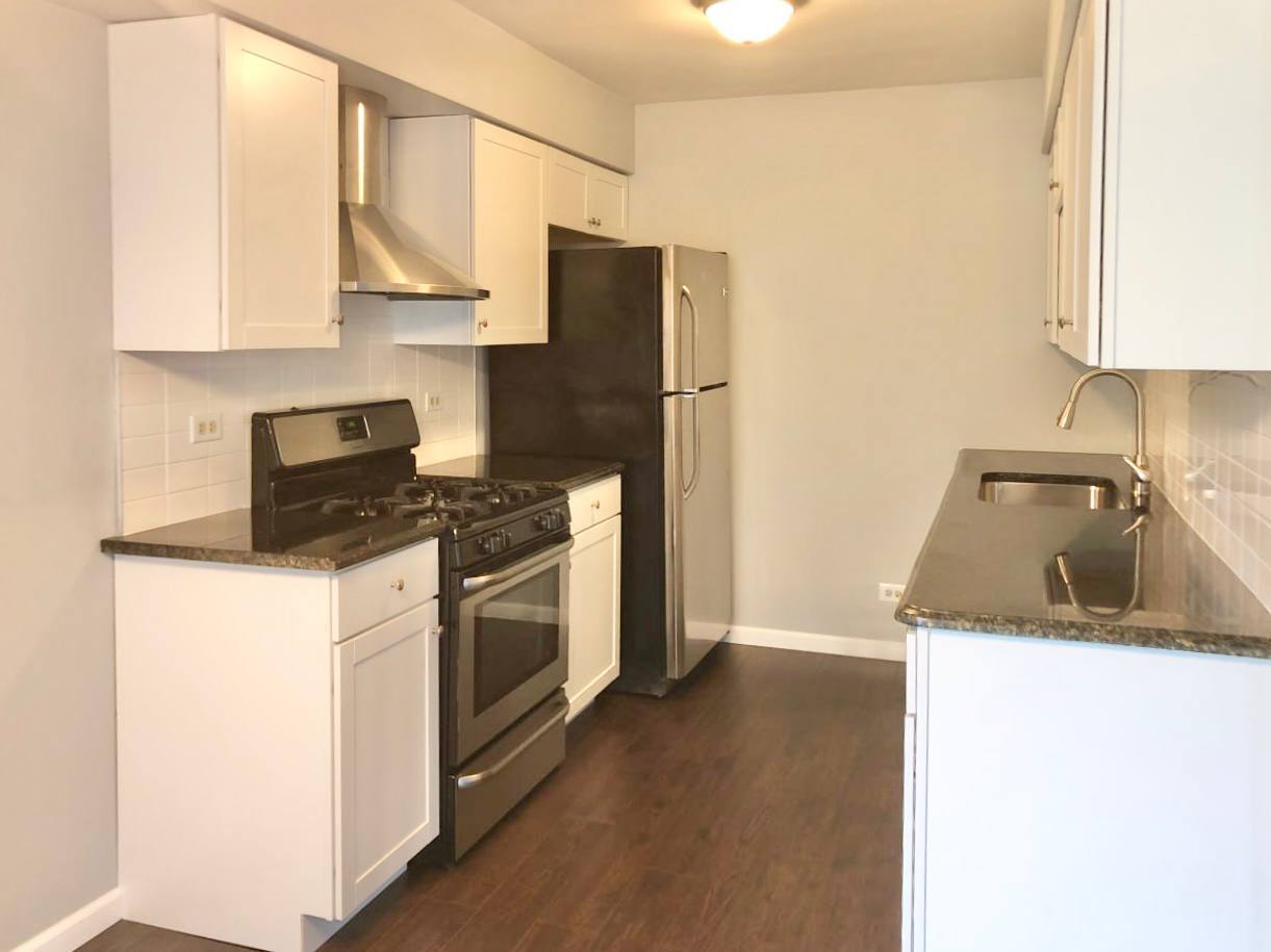 278 Half Moon Circle Aurora, IL 60504 - Photo 8 of 19 a kitchen with a sink stove and refrigerator