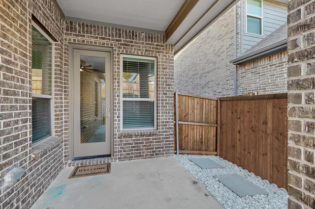 a view of a wooden door of the house