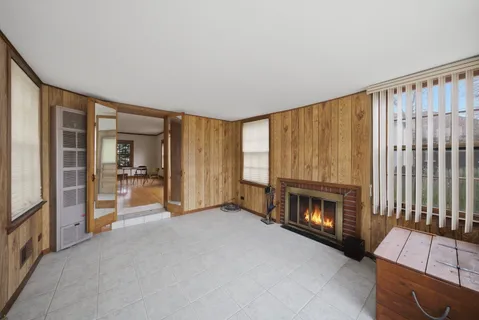 a view of a livingroom with furniture and a fireplace