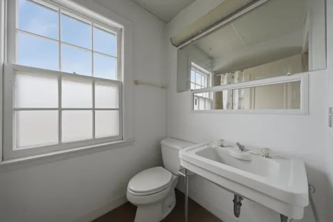 a bathroom with a sink and toilet