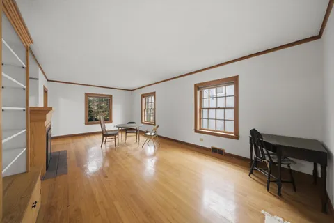 a view of a livingroom with furniture and a workspace