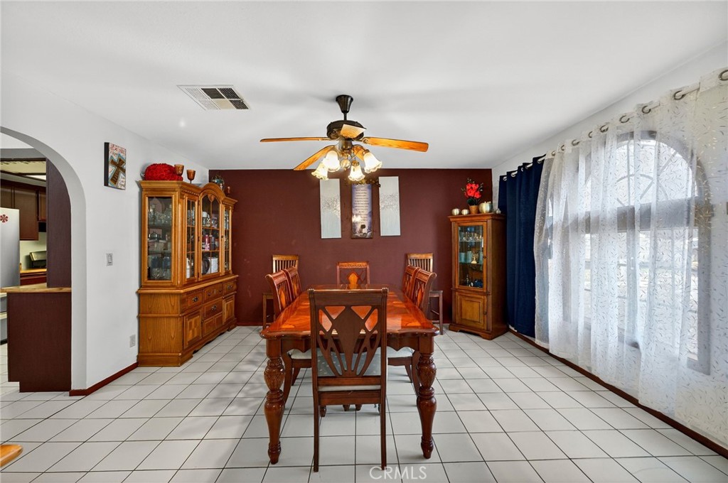 4153 North Webster Avenue Perris, CA 92571 - Photo 15 of 49 a view of a dining room with furniture and chandelier