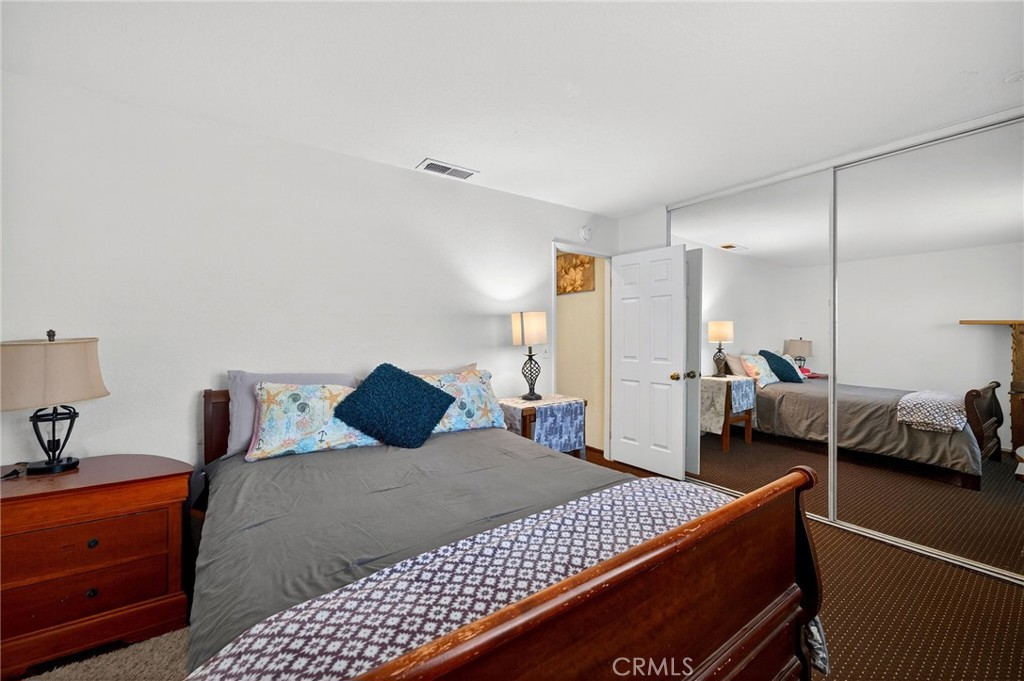 4153 North Webster Avenue Perris, CA 92571 - Photo 23 of 49 a bedroom with a bed and a couch