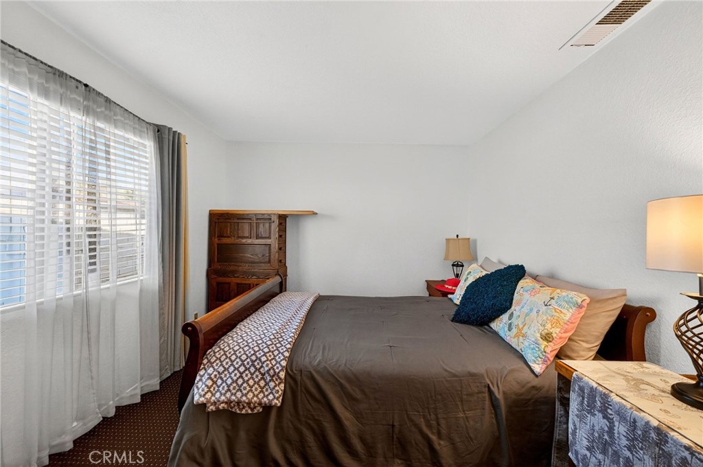 4153 North Webster Avenue Perris, CA 92571 - Photo 24 of 49 a bedroom with a bed and a window