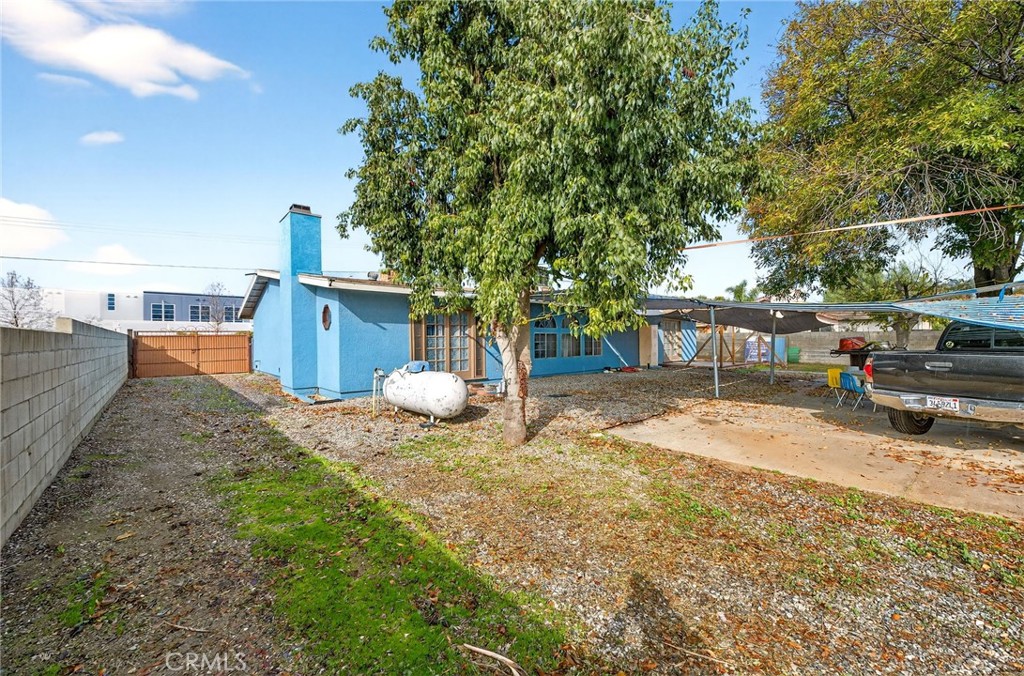 4153 North Webster Avenue Perris, CA 92571 - Photo 36 of 49 a view of a yard with a house and a table and chairs