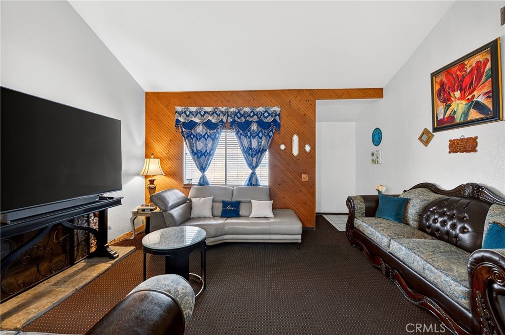 4153 North Webster Avenue Perris, CA 92571 - Photo 5 of 49 a living room with furniture and a flat screen tv