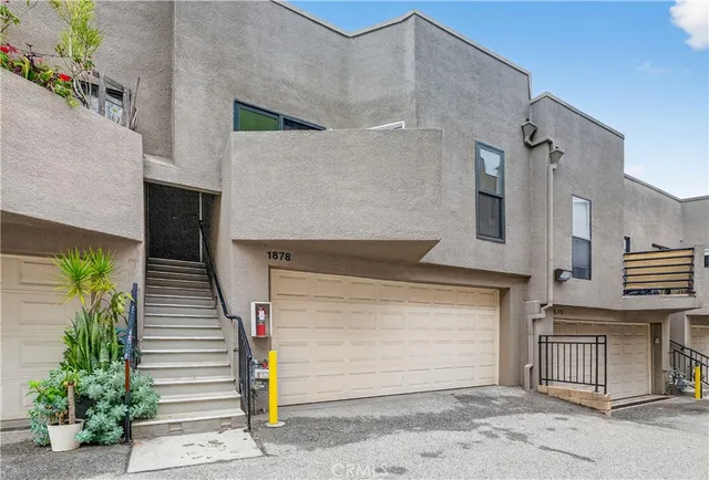 a front view of a house with garage