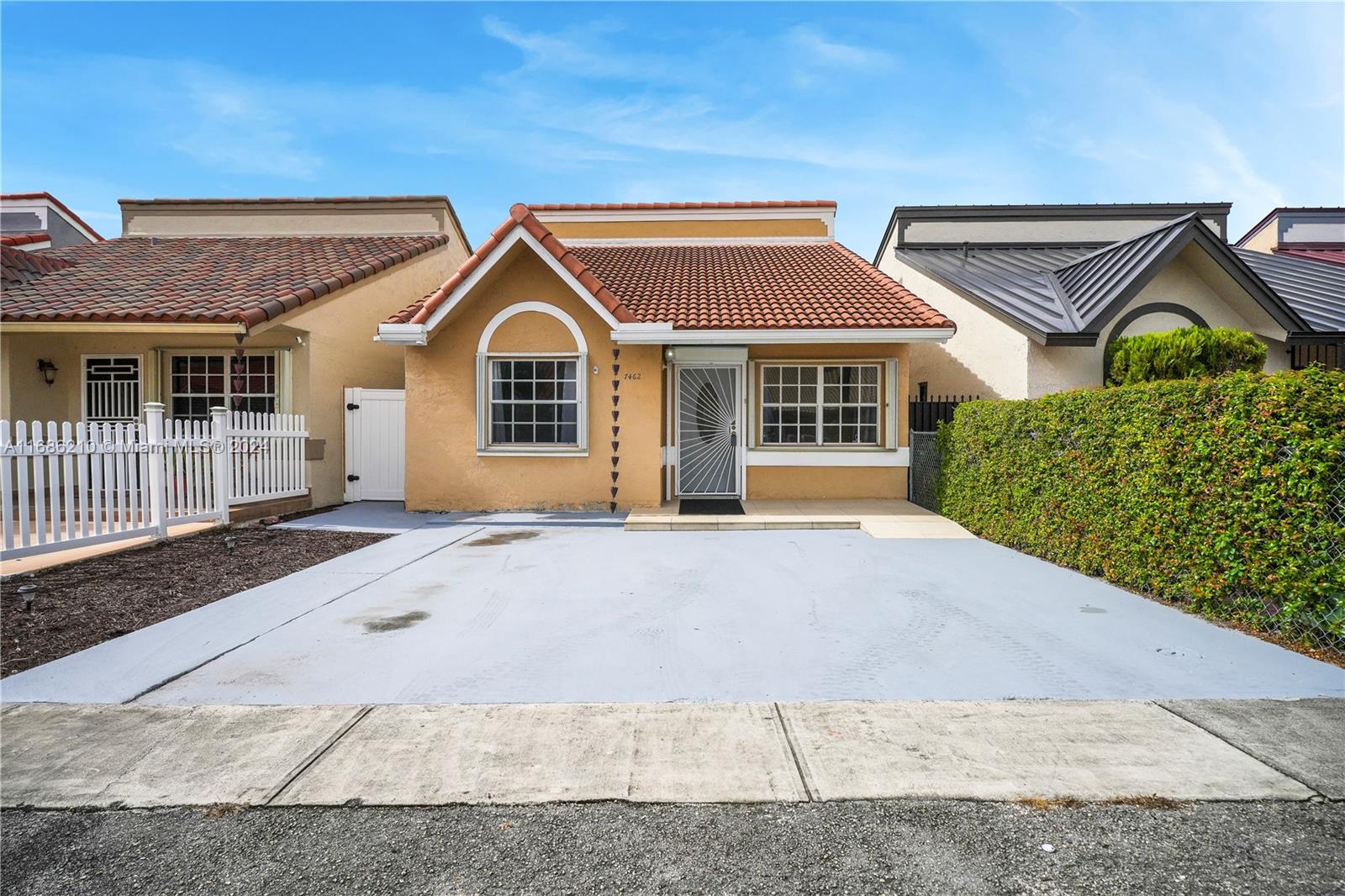 7462 West 29th Way Hialeah, FL 33018 - Photo 1 of 13 front view of a house with a yard