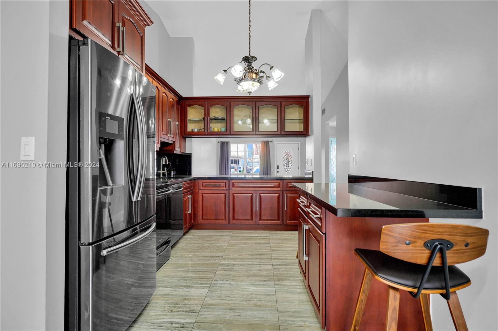 7462 West 29th Way Hialeah, FL 33018 - Photo 4 of 13 a kitchen with stainless steel appliances granite countertop a kitchen island a stove a refrigerator and a cabinets
