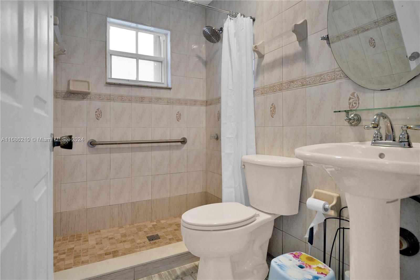 7462 West 29th Way Hialeah, FL 33018 - Photo 10 of 13 a bathroom with a sink toilet and shower