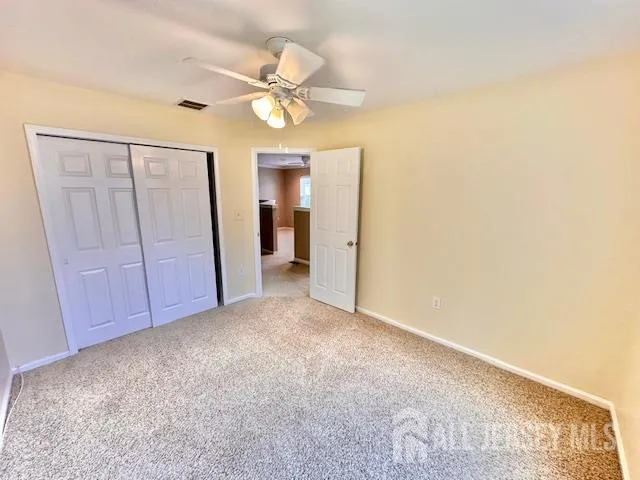 an empty room with a fireplace