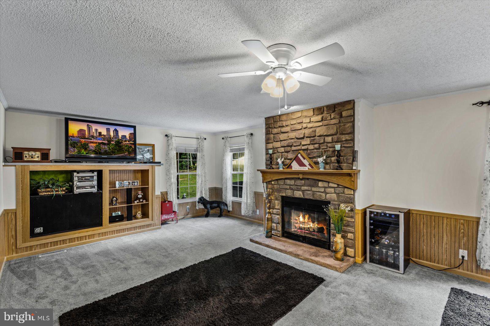 115 Anna Highview Drive Bumpass, VA 23024 - Photo 8 of 40 Cozy up next to the beautiful stone fireplace!