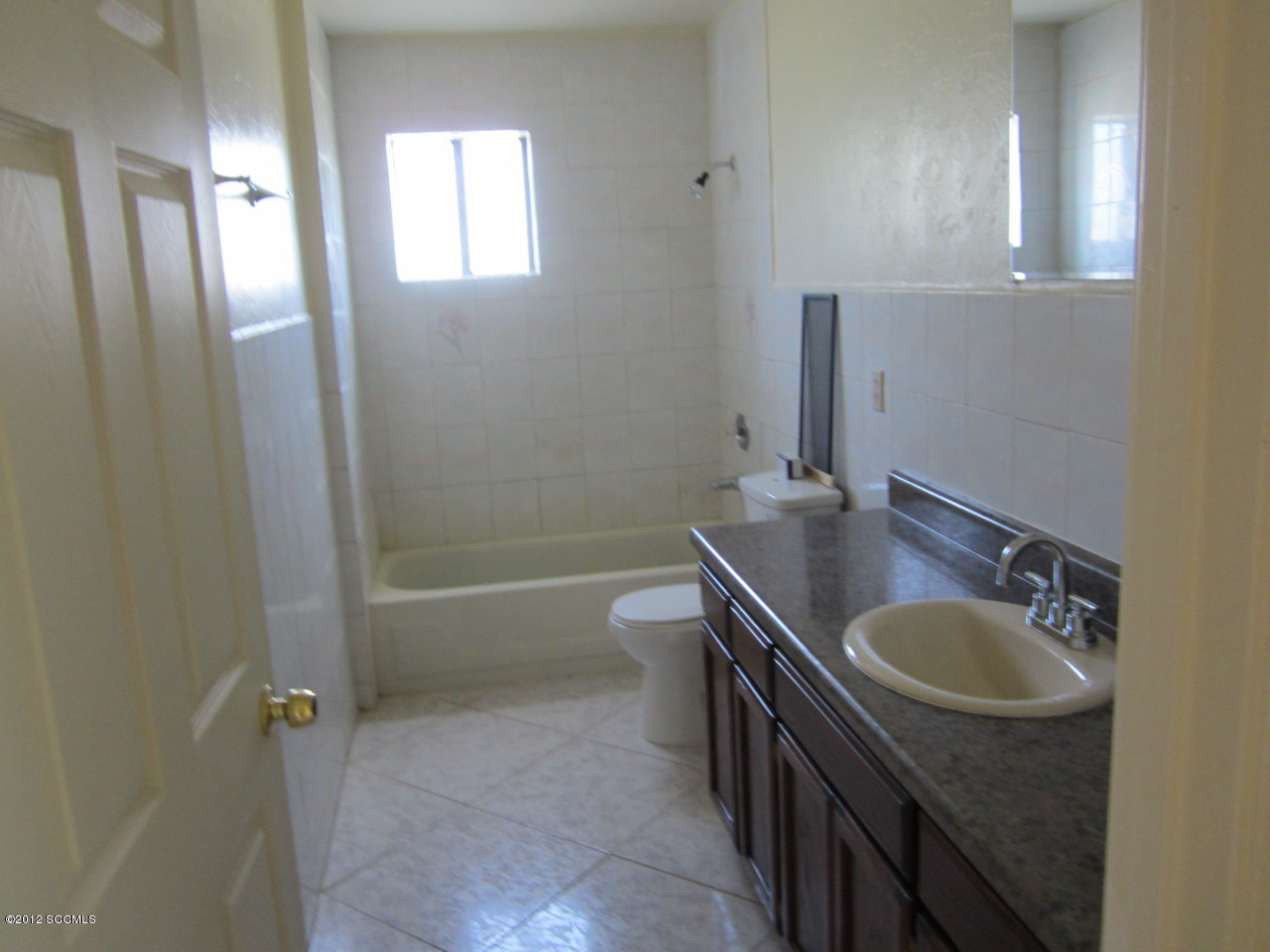 168 Capullo Court Rio Rico, AZ 85648 - Photo 5 of 7 a bathroom with a sink a toilet and shower