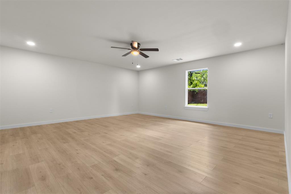 907 Pinson Road Forney, TX 75126 - Photo 13 of 35 Spacious interior room featuring light wood-finish flooring
