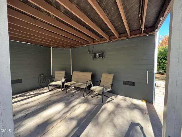 a view of balcony with furniture