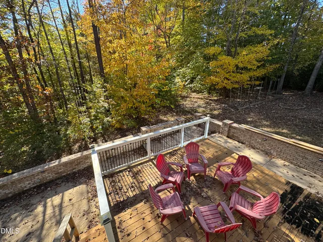 a view of a backyard with sitting area