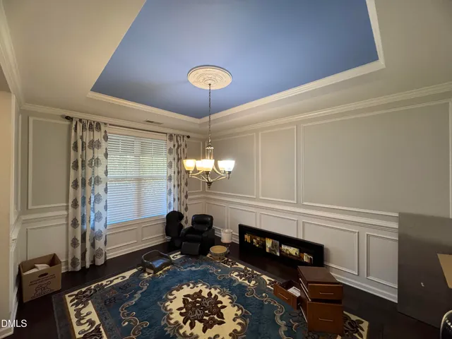 a room with furniture and a chandelier