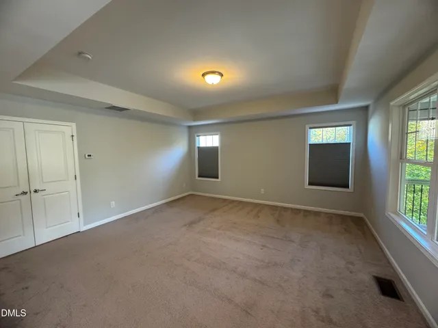 a bathroom with a granite countertop double vanity sink and a mirror