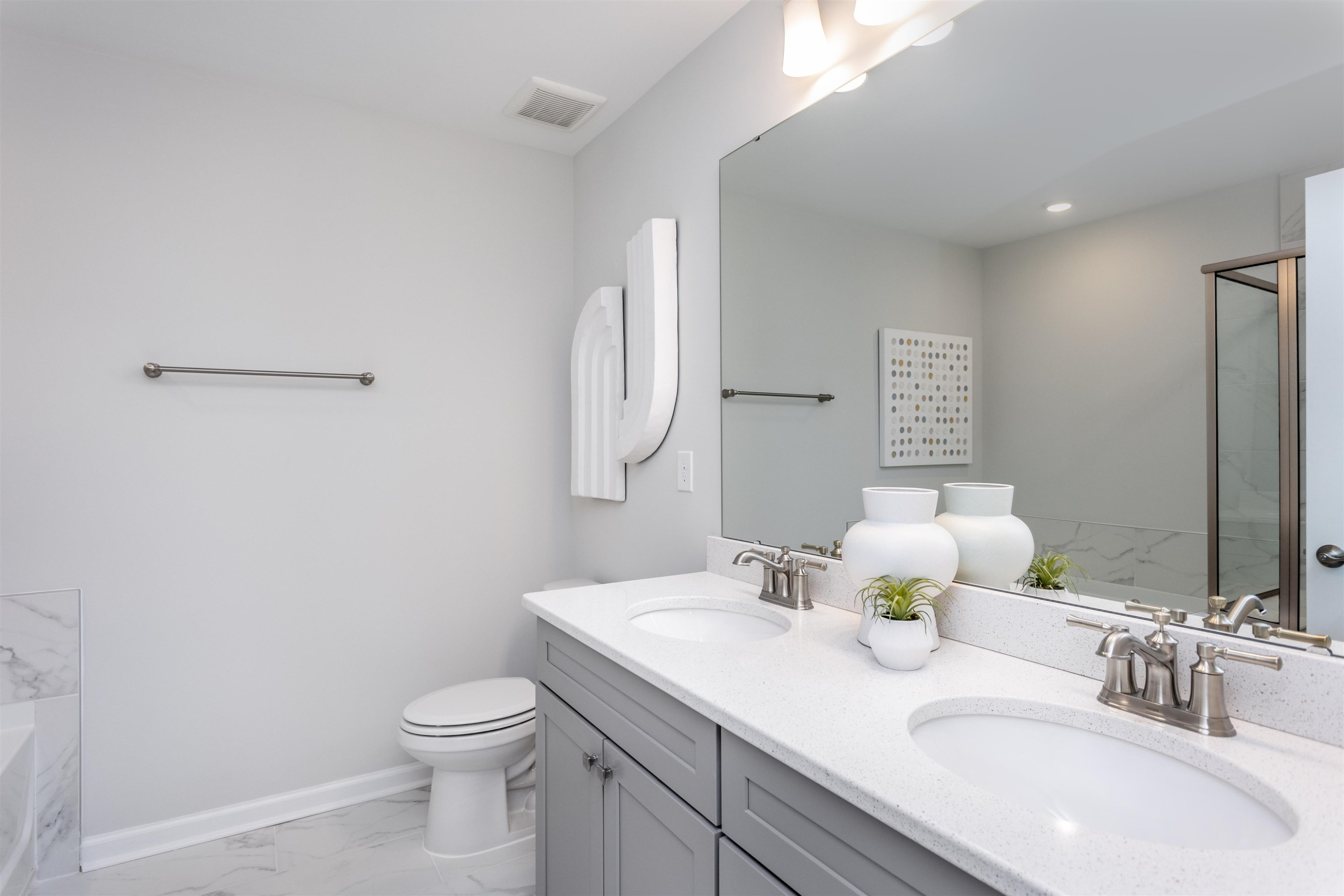 5701 Preveza Place Raleigh, NC 27603 - Photo 16 of 21 a bathroom with a sink toilet and mirror