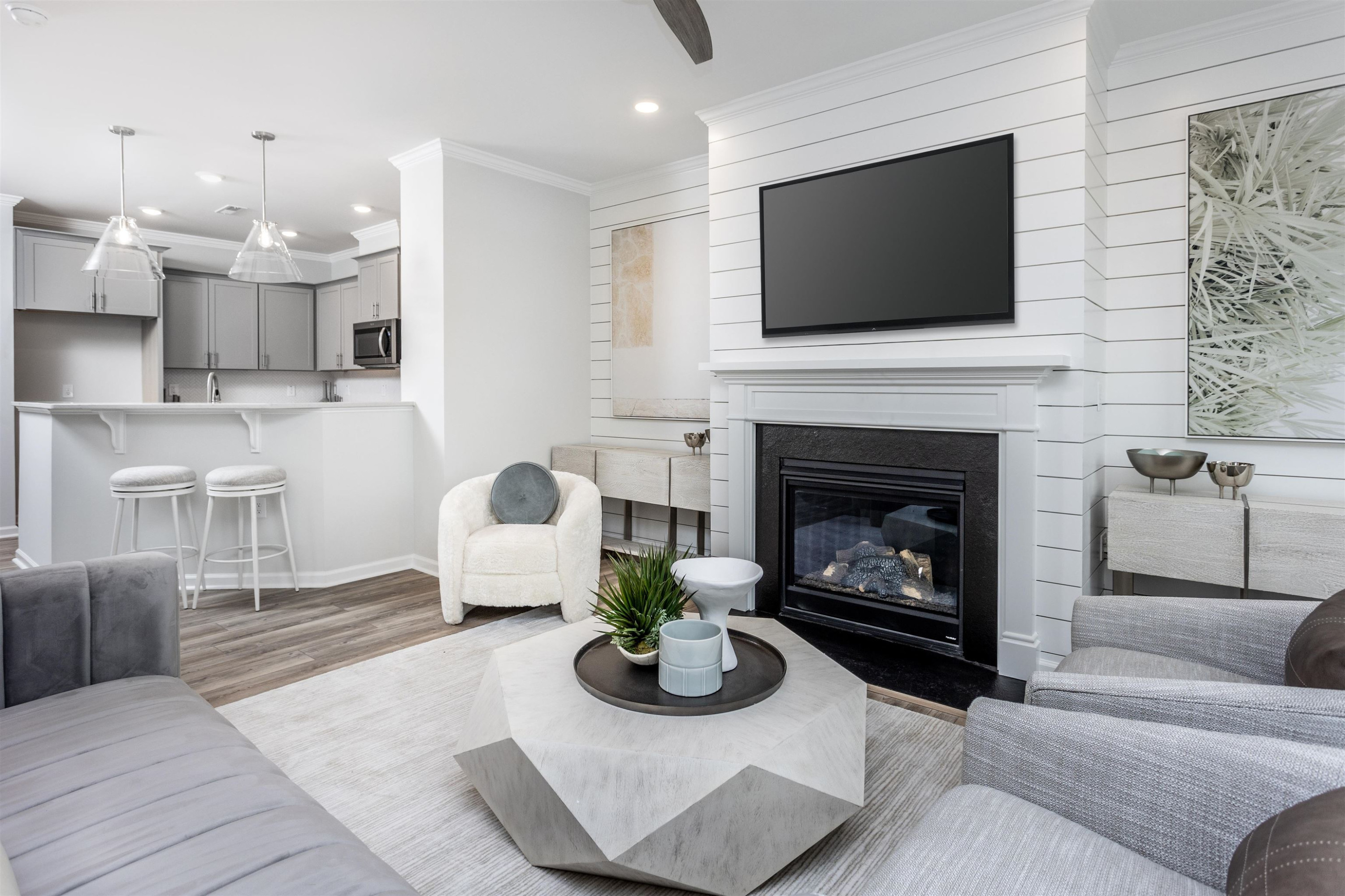 5701 Preveza Place Raleigh, NC 27603 - Photo 4 of 21 a living room with furniture a flat screen tv and a fireplace