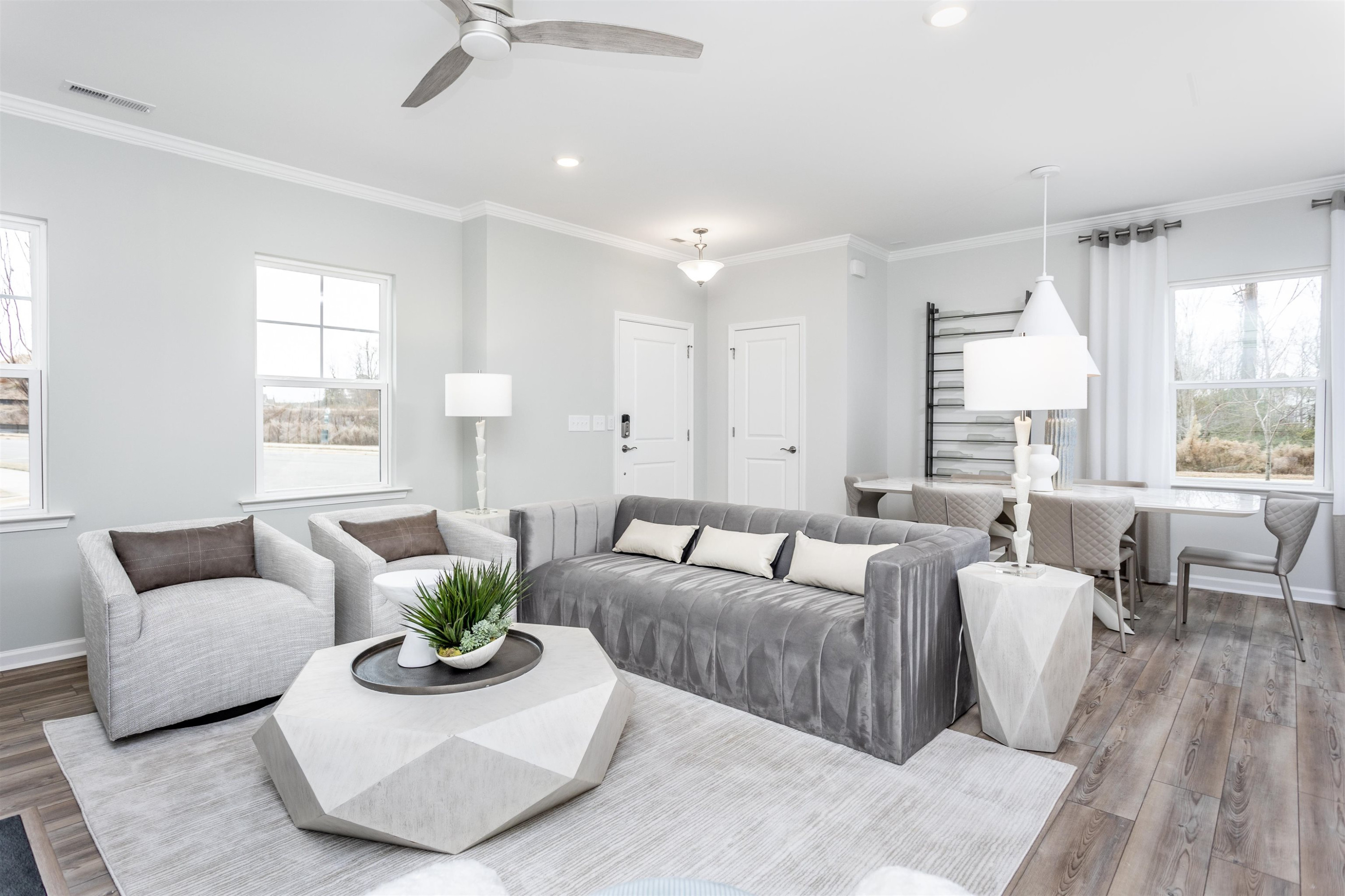5701 Preveza Place Raleigh, NC 27603 - Photo 6 of 21 a living room with furniture potted plant and a large window