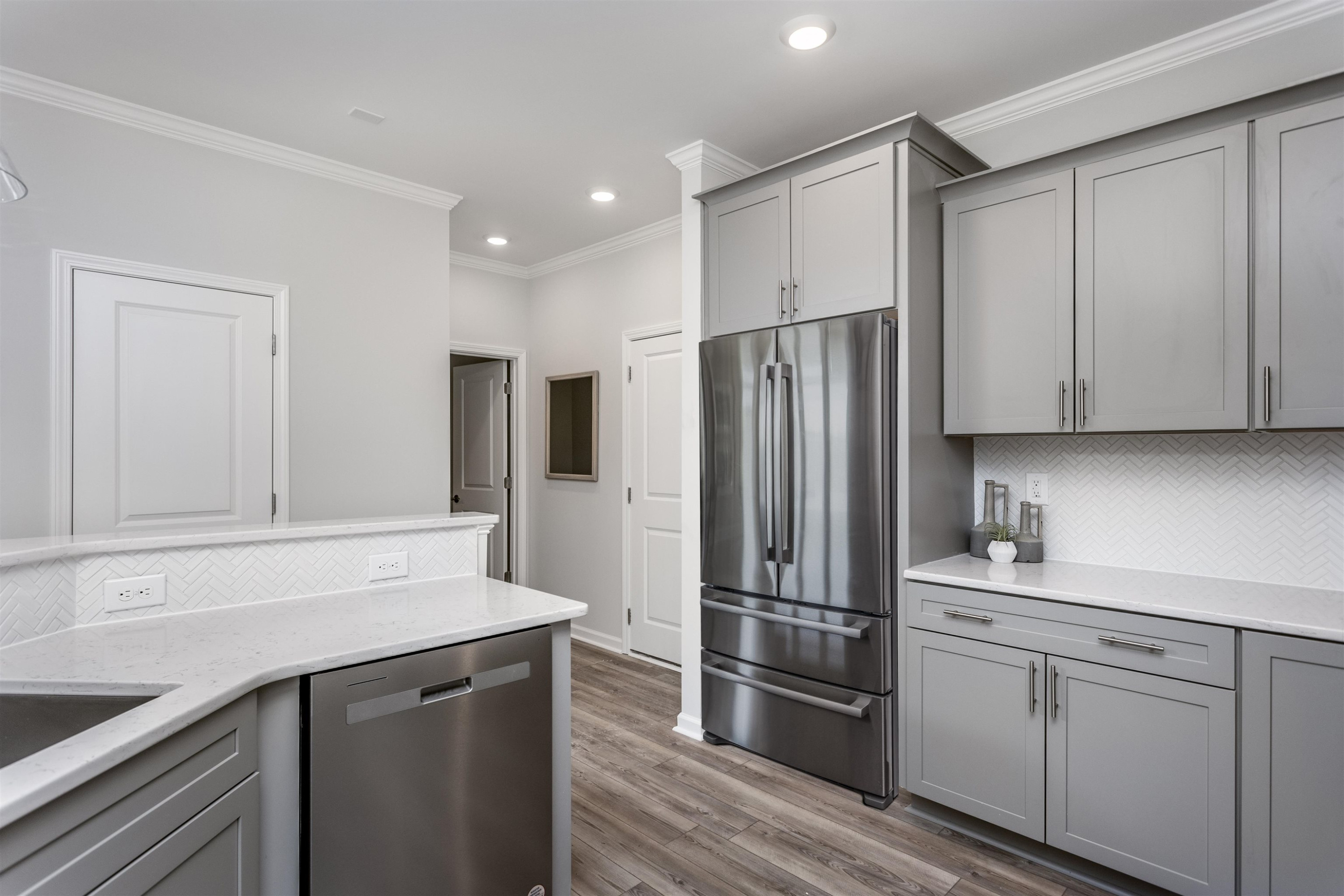 5701 Preveza Place Raleigh, NC 27603 - Photo 10 of 21 a kitchen with a refrigerator sink and cabinets