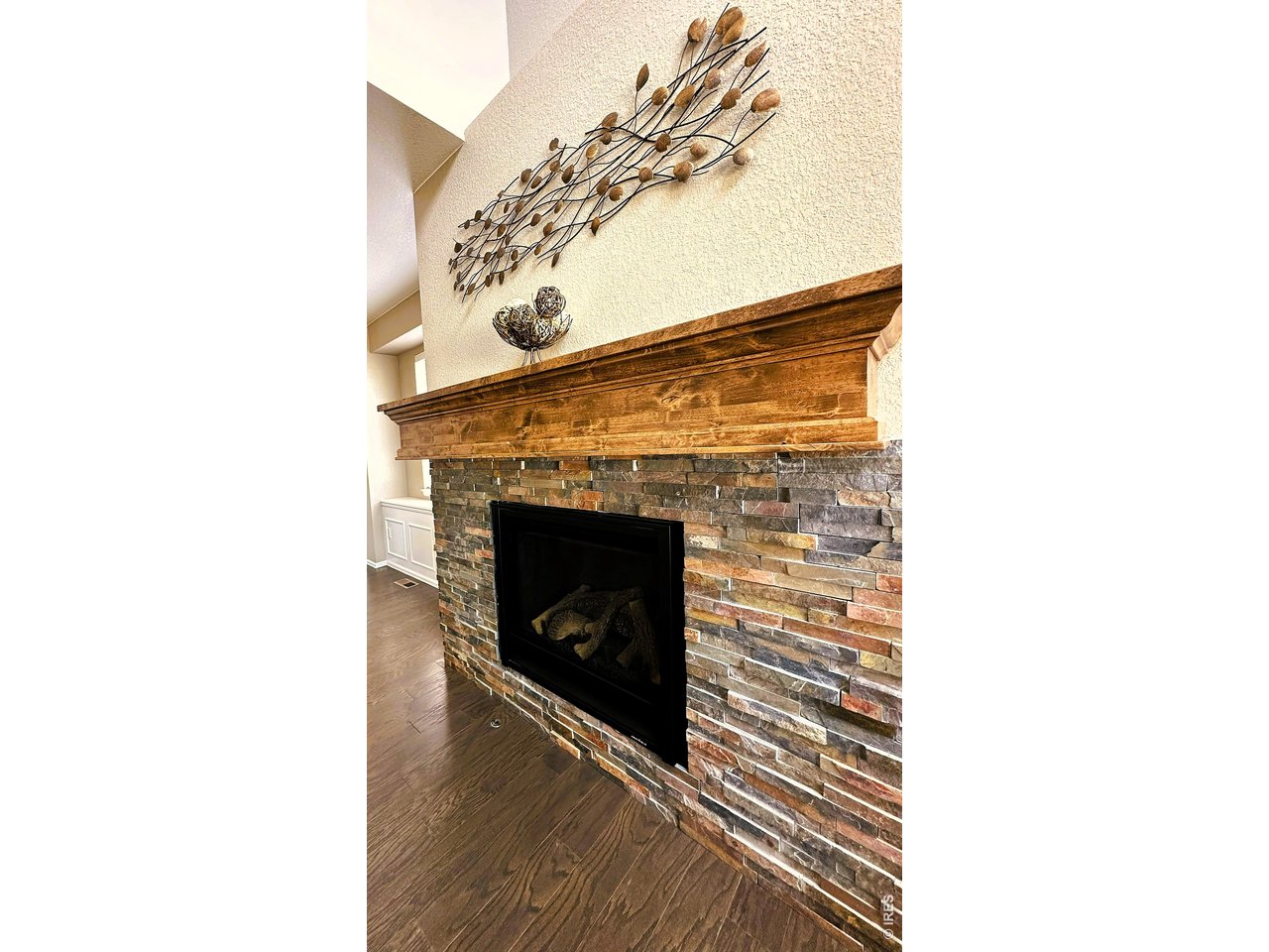 10434 Bluegrass Street Firestone, CO 80504 - Photo 8 of 26 Custom beam on your fire place