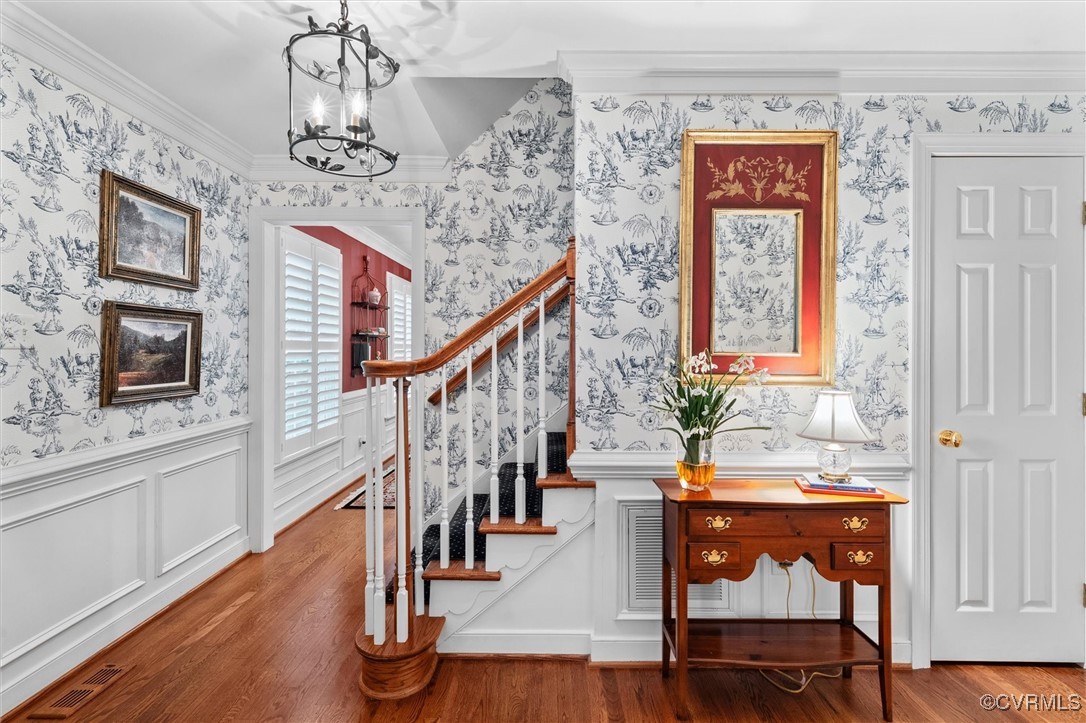 5911 Waters Edge Road Midlothian, VA 23112 - Photo 11 of 50 Stairway featuring wallpapered walls, a chandelier