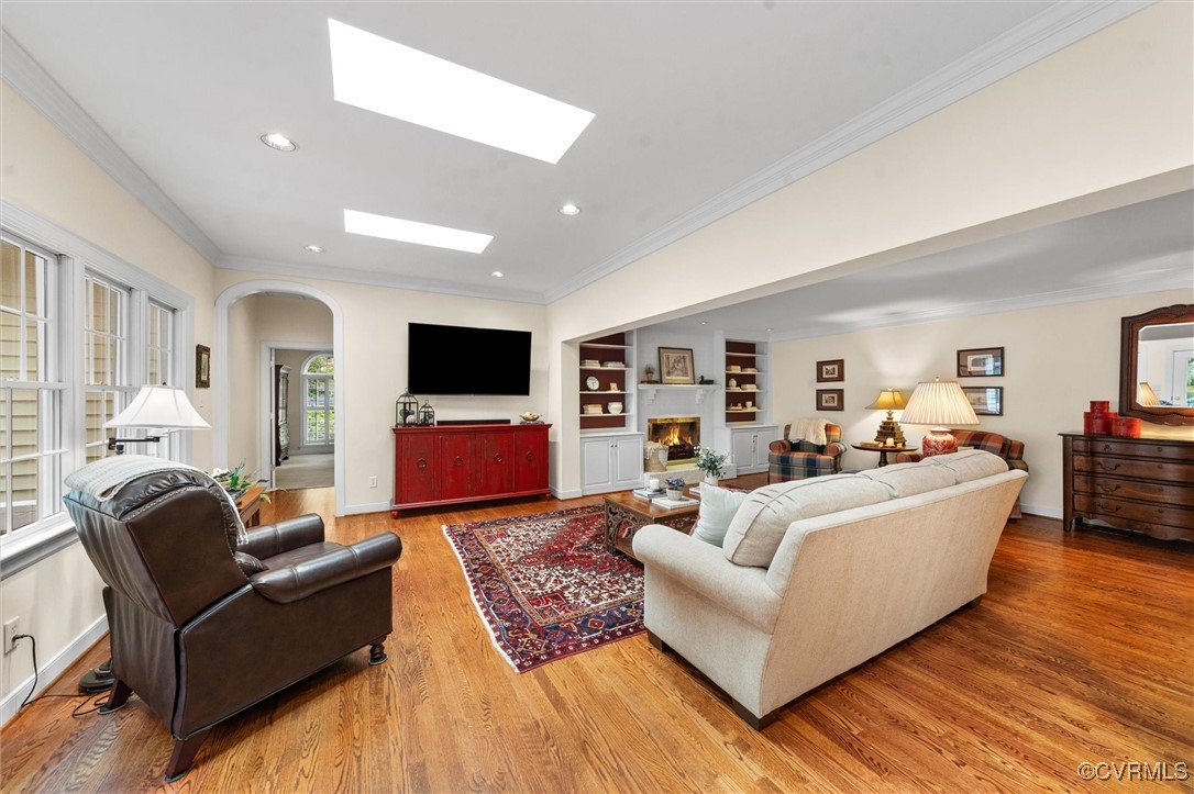 5911 Waters Edge Road Midlothian, VA 23112 - Photo 20 of 50 Living area featuring arched walkways, crown moldi