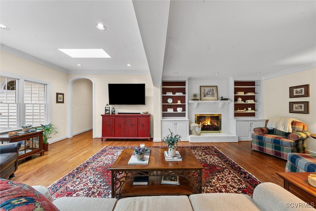 5911 Waters Edge Road Midlothian, VA 23112 - Photo 21 of 50 Living area featuring a skylight, arched walkways,