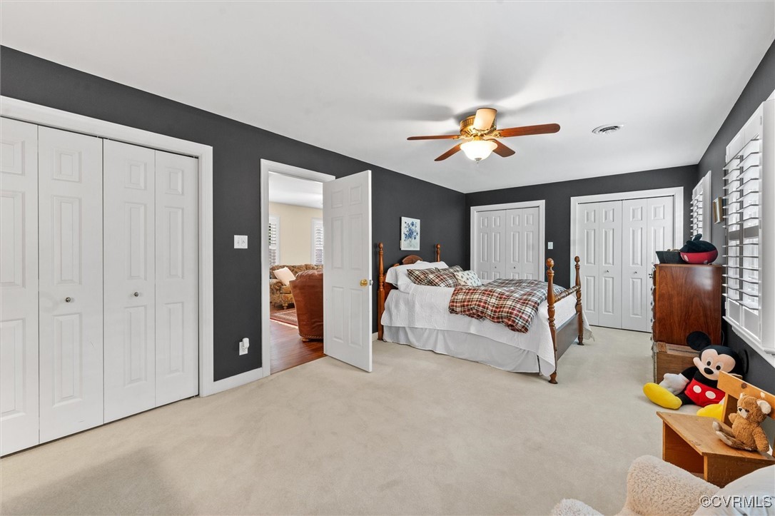 5911 Waters Edge Road Midlothian, VA 23112 - Photo 34 of 50 Bedroom featuring two closets, carpet flooring, mu