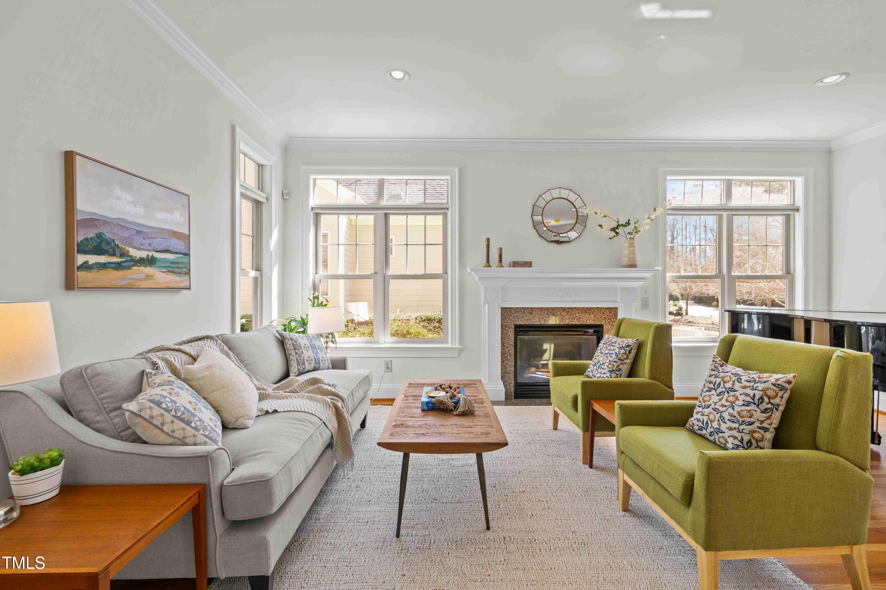 10040 Ward Chapel Hill, NC 27517 - Photo 14 of 56 a living room with furniture a rug a window and a fireplace