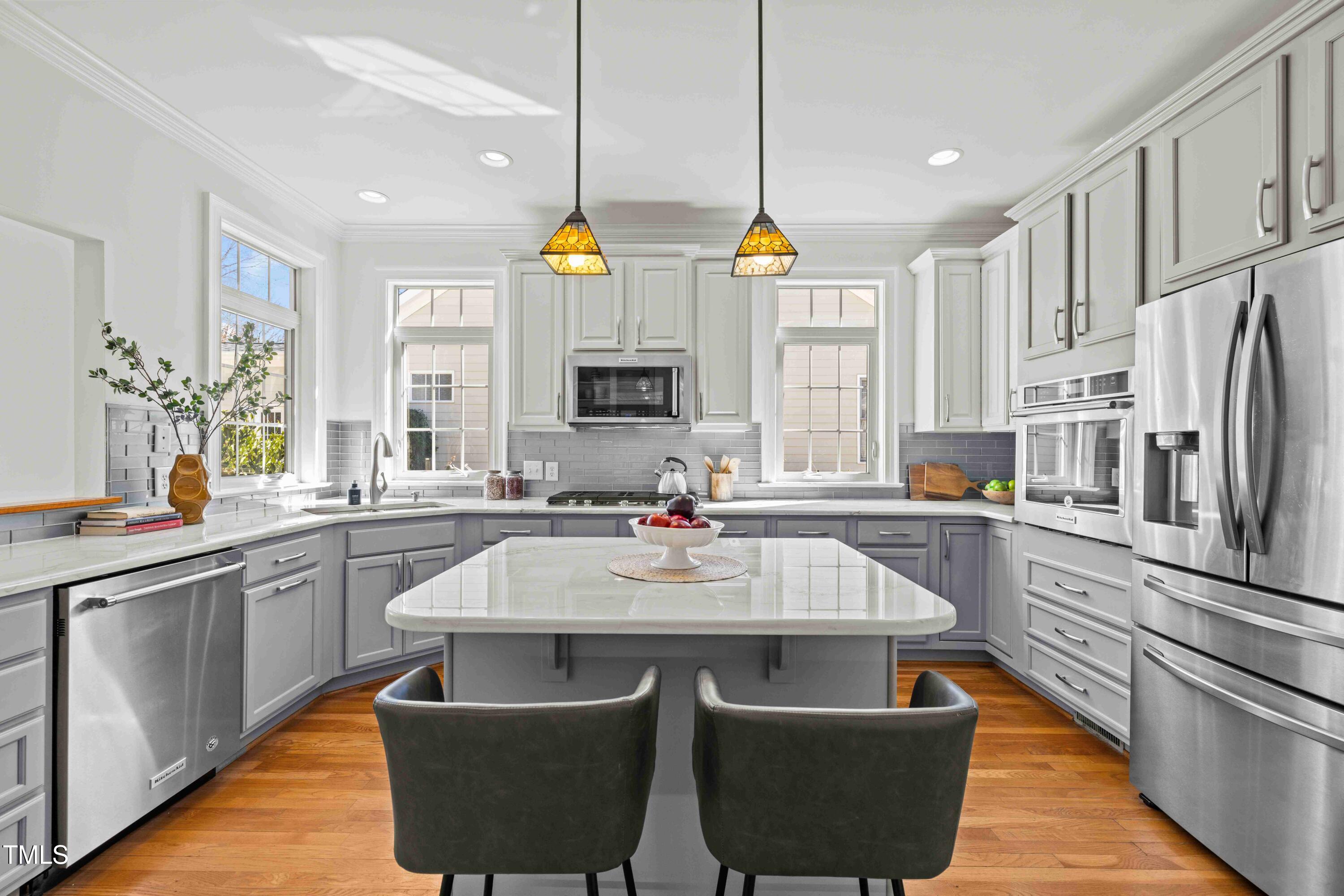 10040 Ward Chapel Hill, NC 27517 - Photo 17 of 56 a kitchen with stainless steel appliances granite countertop a sink a stove and a refrigerator