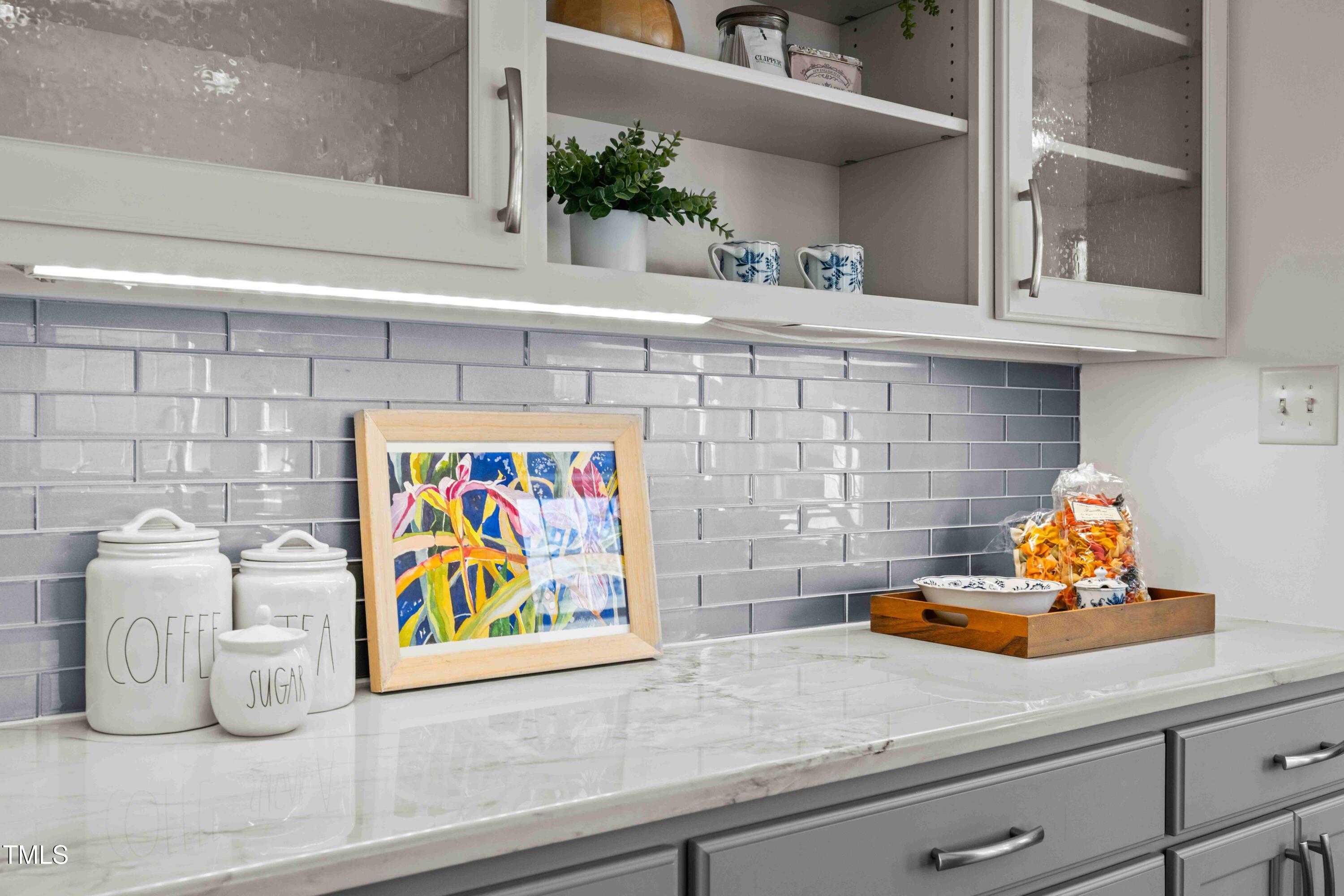 10040 Ward Chapel Hill, NC 27517 - Photo 20 of 56 a utility room with a sink and lots of potted plants