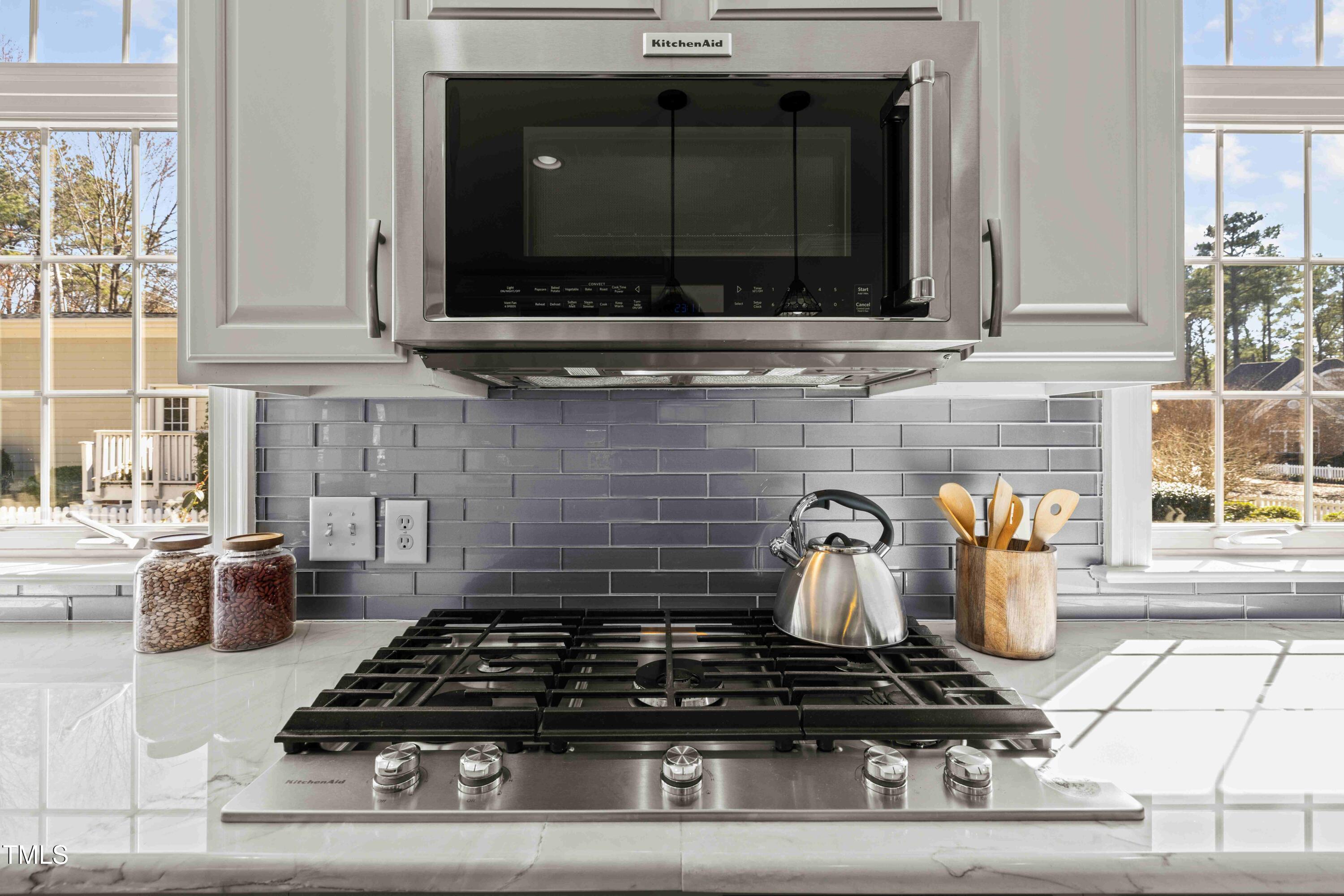 10040 Ward Chapel Hill, NC 27517 - Photo 21 of 56 a kitchen with a stove and a microwave