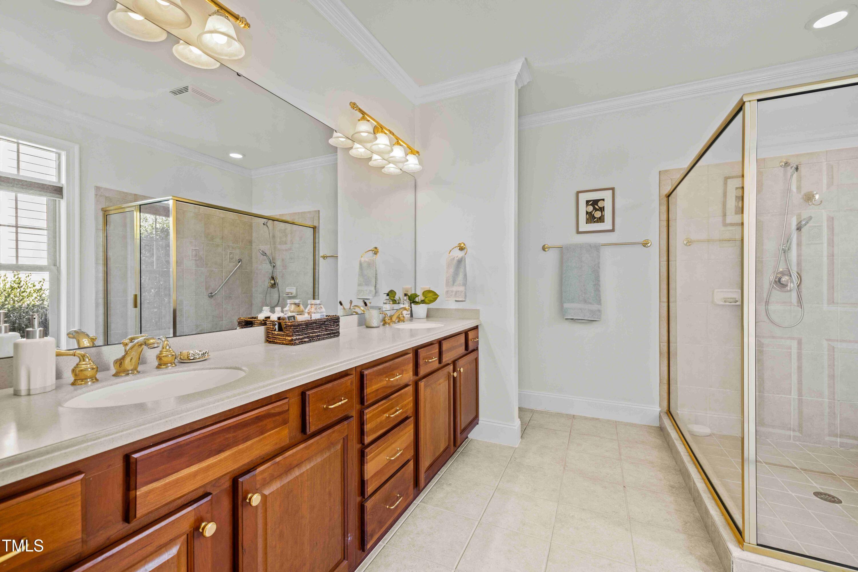 10040 Ward Chapel Hill, NC 27517 - Photo 28 of 56 a bathroom with a sink double vanity and a mirror