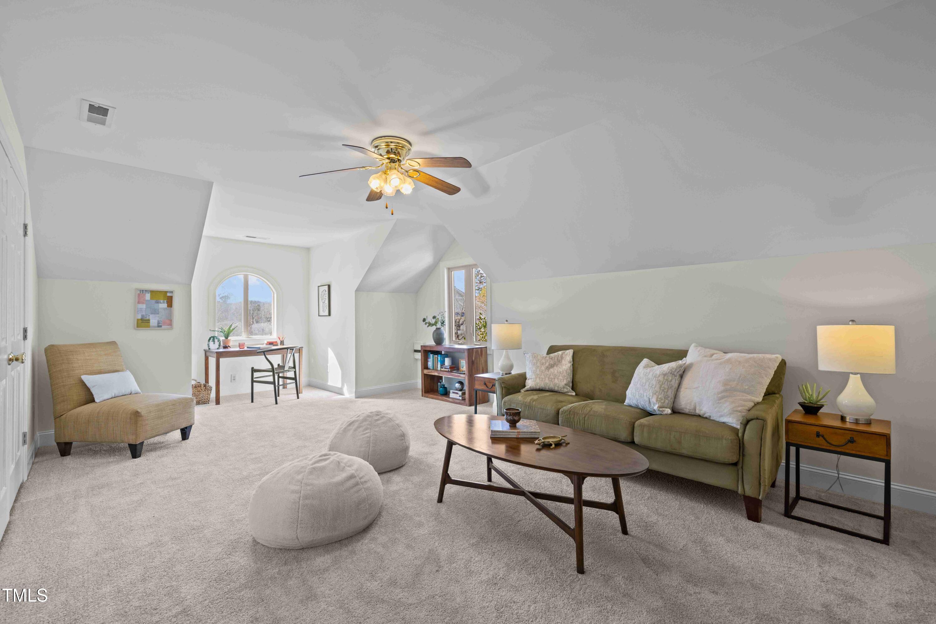 10040 Ward Chapel Hill, NC 27517 - Photo 33 of 56 a living room with furniture and a lamp