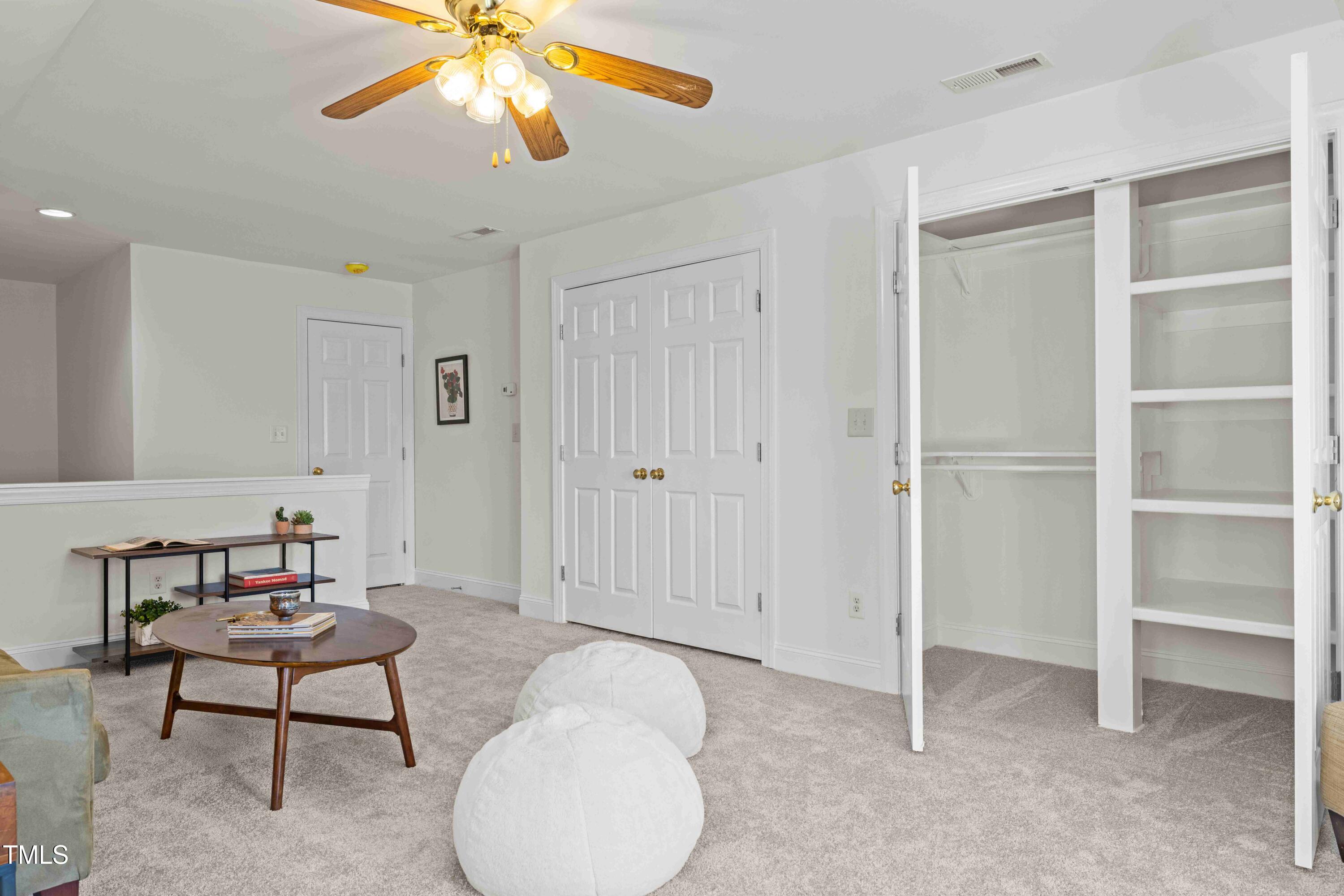10040 Ward Chapel Hill, NC 27517 - Photo 35 of 56 a view of a livingroom with furniture and a chandelier fan