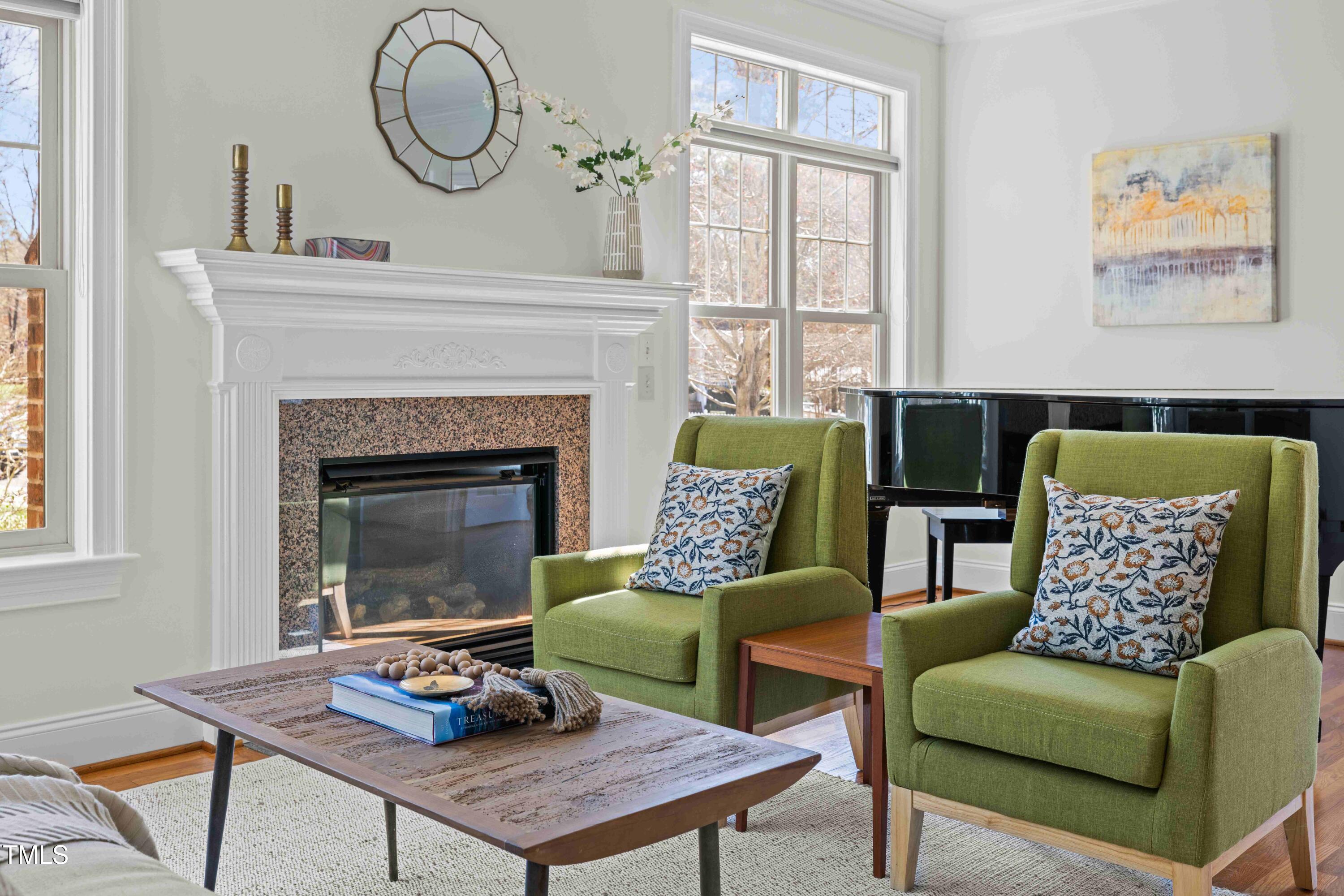10040 Ward Chapel Hill, NC 27517 - Photo 38 of 56 a living room with furniture a window and a fireplace