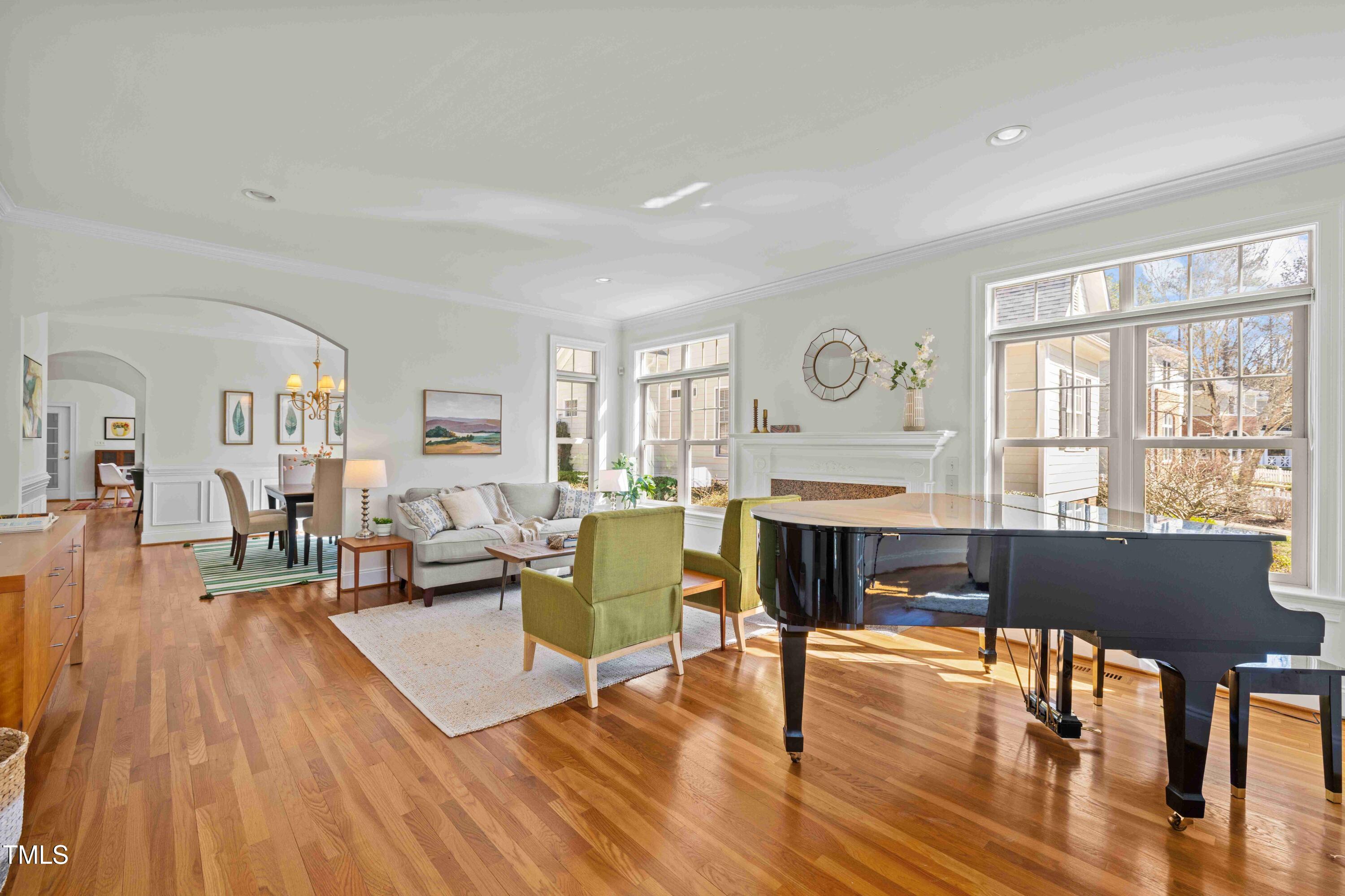 10040 Ward Chapel Hill, NC 27517 - Photo 4 of 56 a living room with fireplace furniture wooden floor and a large window