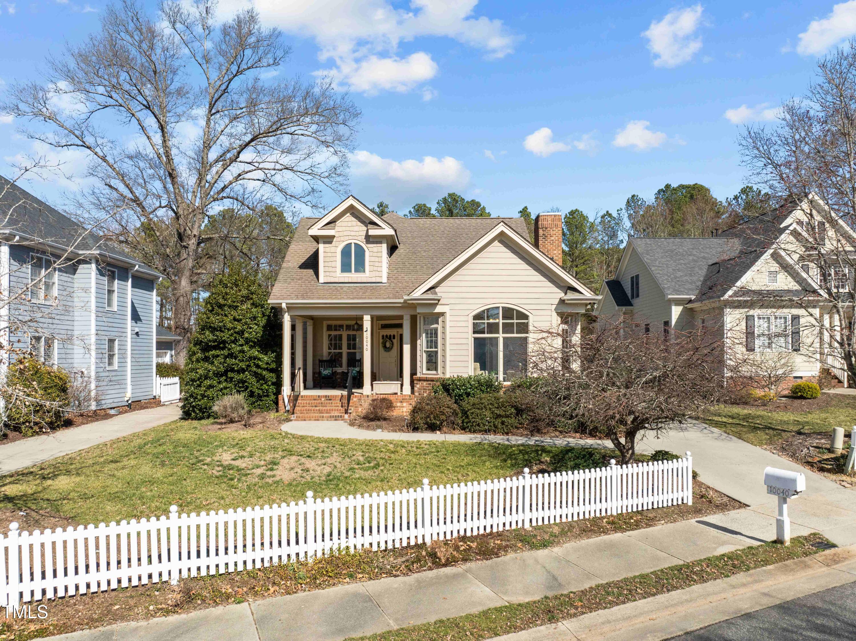 10040 Ward Chapel Hill, NC 27517 - Photo 42 of 56 a front view of a house with a yard