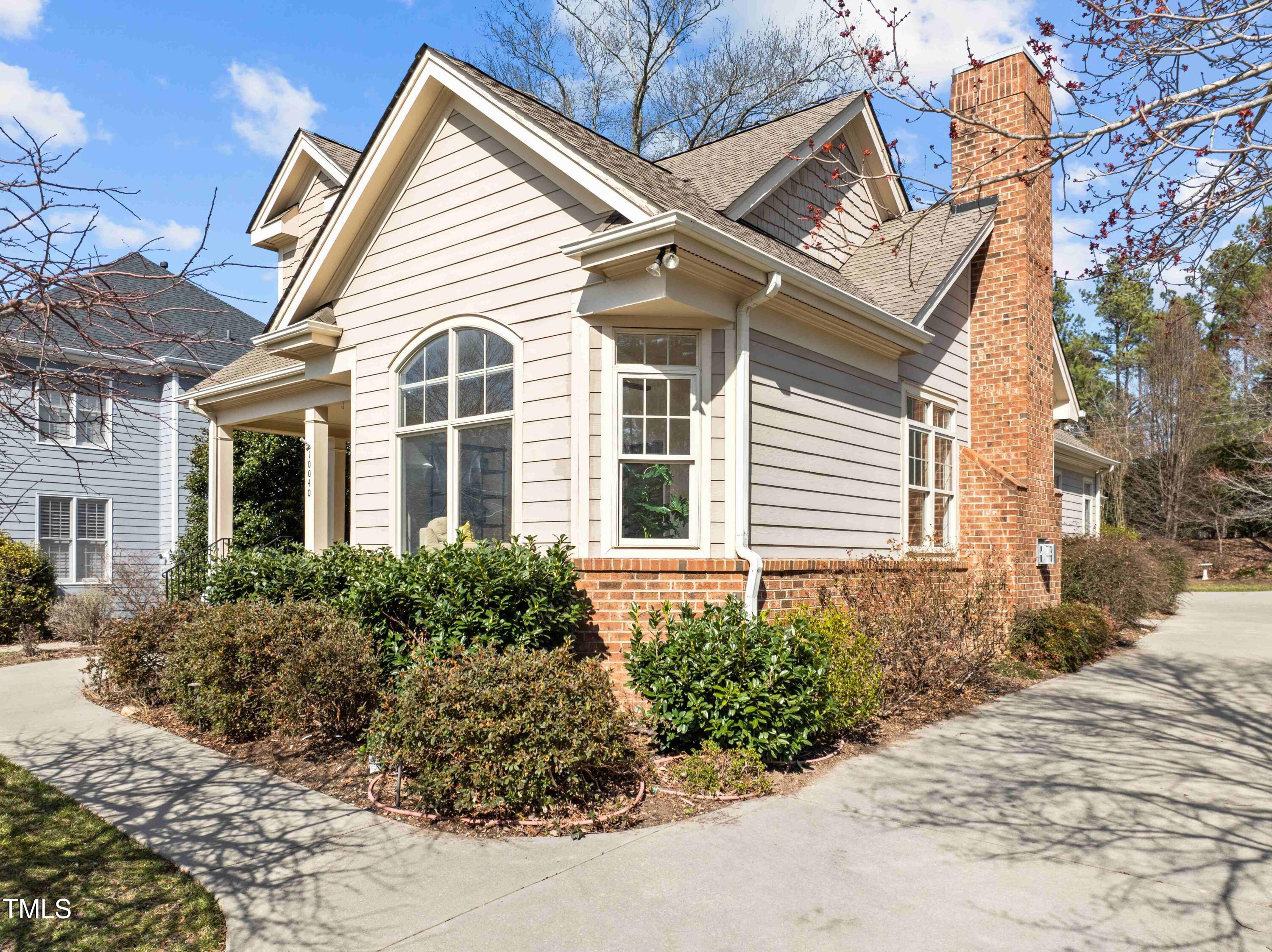 10040 Ward Chapel Hill, NC 27517 - Photo 46 of 56 a view of a white house next to a yard
