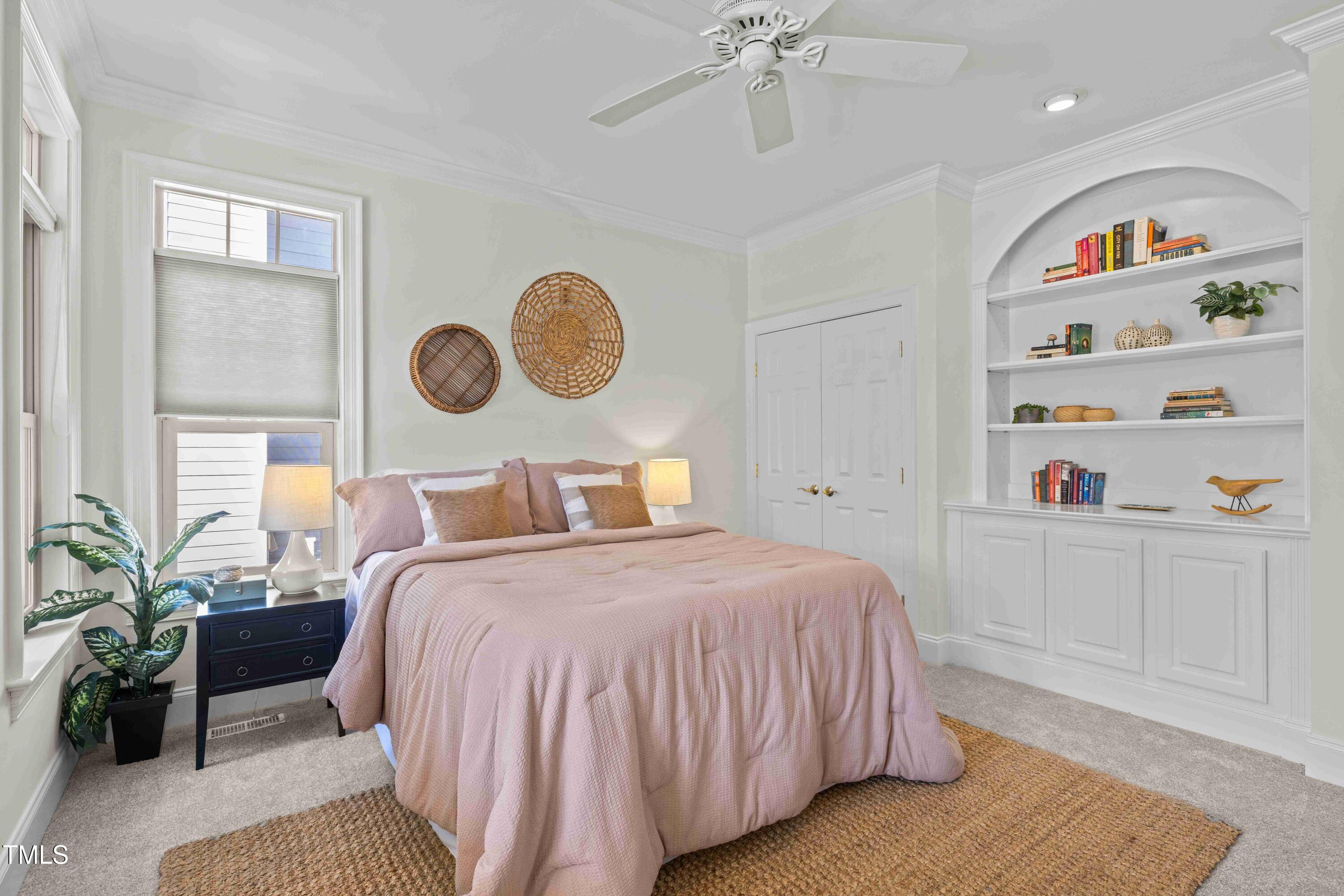 10040 Ward Chapel Hill, NC 27517 - Photo 7 of 56 a bedroom with a bed and a chandelier