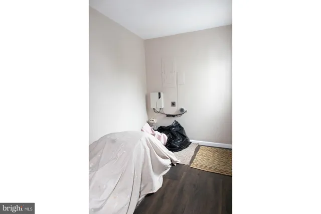 a view of a room with a ceiling fan and a window