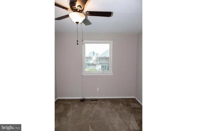 an empty room with closet area