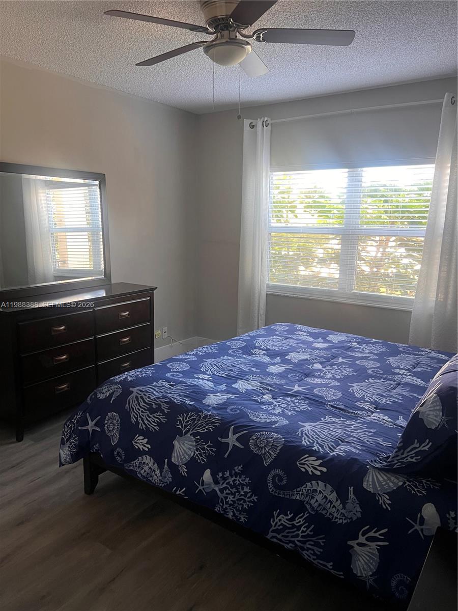 400 North Riverside Drive, Unit 214 Pompano Beach, FL 33062 - Photo 14 of 67 a bedroom with a bed and a window