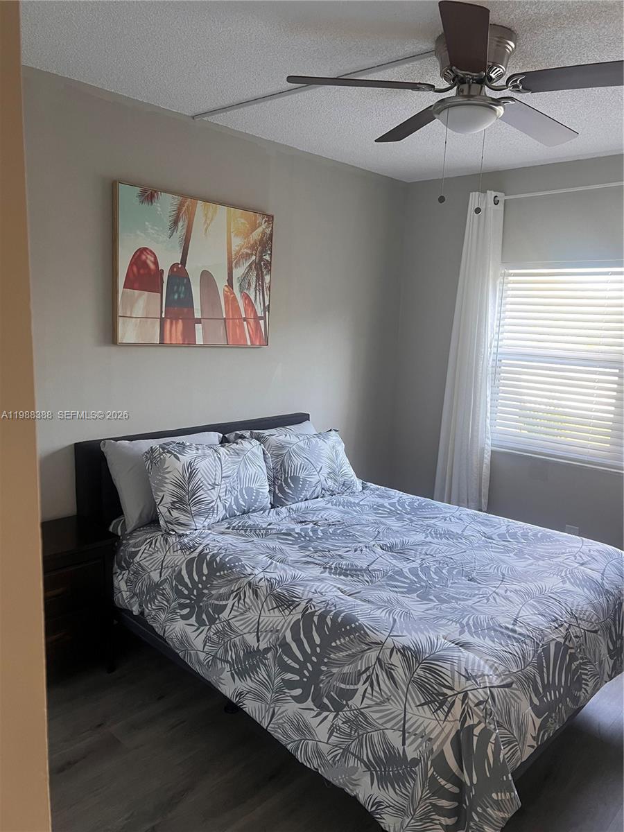 400 North Riverside Drive, Unit 214 Pompano Beach, FL 33062 - Photo 18 of 67 a bedroom with a large bed and a window