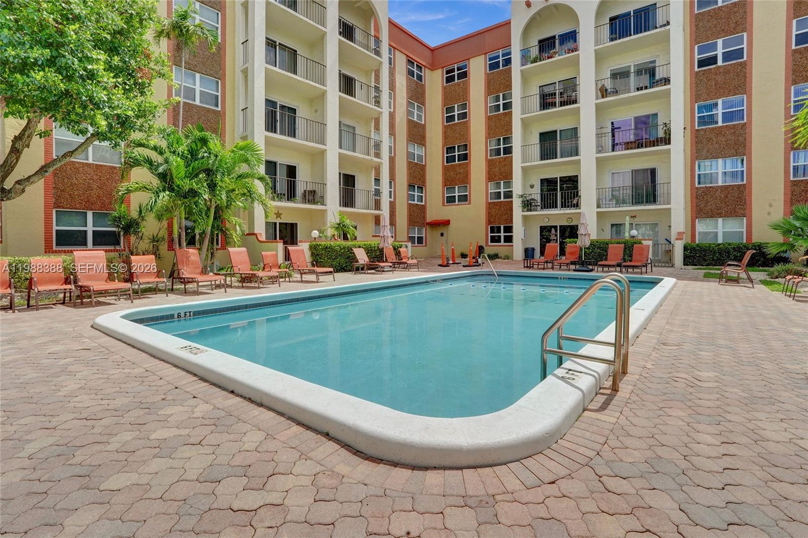 400 North Riverside Drive, Unit 214 Pompano Beach, FL 33062 - Photo 25 of 67 a view of a swimming pool with a lounge chair